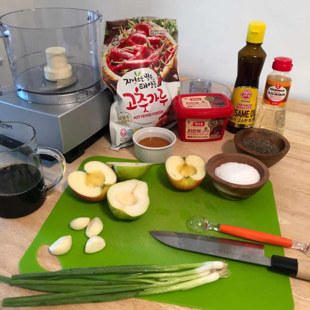 Gochugaru 고추가루 (Korean chili powder) and Ingredients for Galbi Jim, including Gochujang 고추장 (Korean chili paste), in the background.