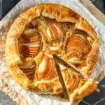 Pear galette on parchment paper.