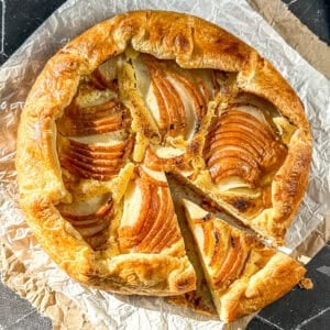 Pear galette on parchment paper.