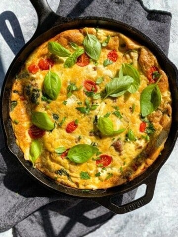 Cast iron pan with frittata made with Italian ingredients.