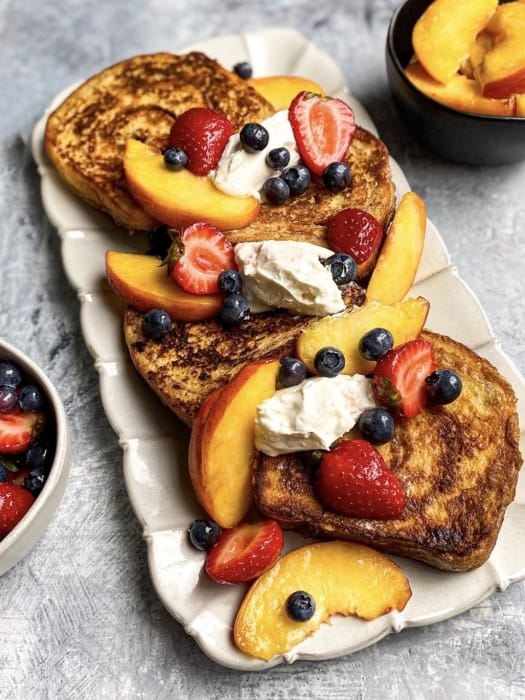 Cinnamon-Cardamom French Toast with macerated fruit and whipped cream