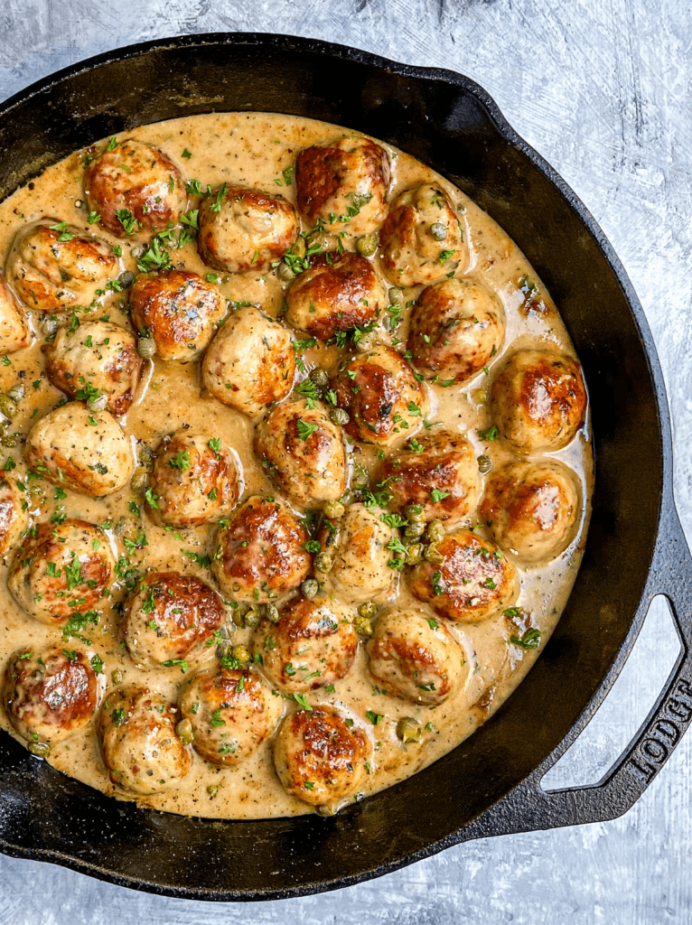 Chicken Piccata Meatballs swimming in a lemony gravy