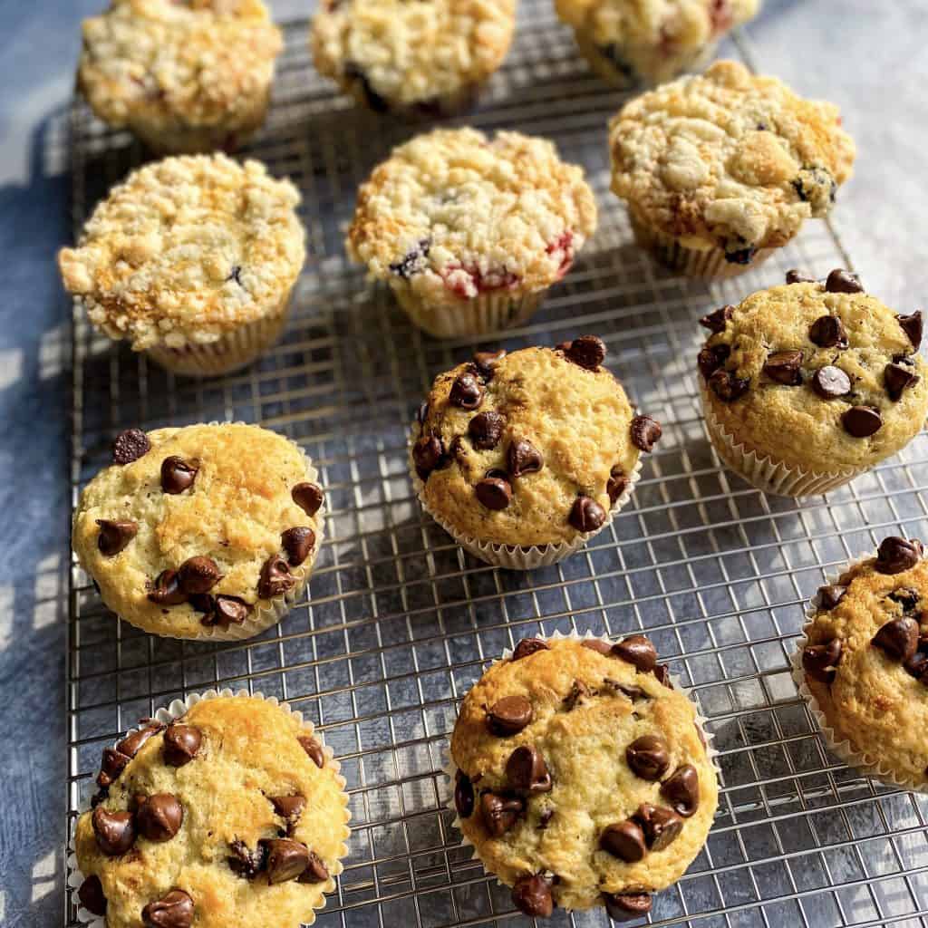 Blueberry Streusel and Chocolate Chip Muffins, cooling on a wire rack.