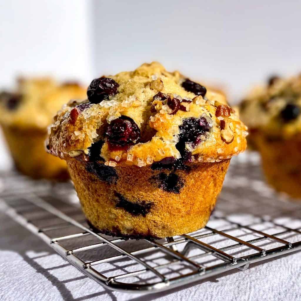 Blueberry Pecan Buttermilk Muffin on a wire rack