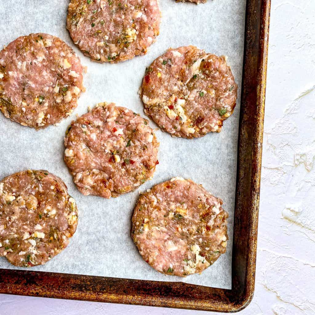 Ground Breakfast Sausage Patties on a sheet pan.