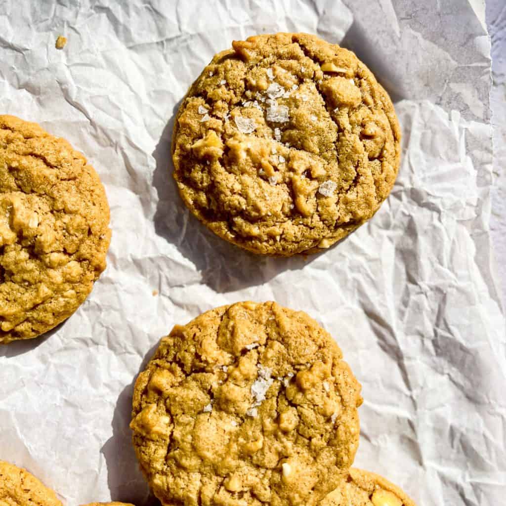 Peanut Butter White Chocolate Oatmeal Cookies on crinkly white parchment paper