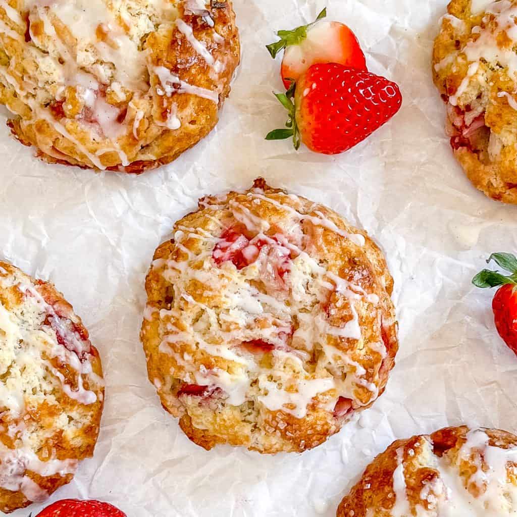 Strawberry Rosemary Scones on white parchment paper.
