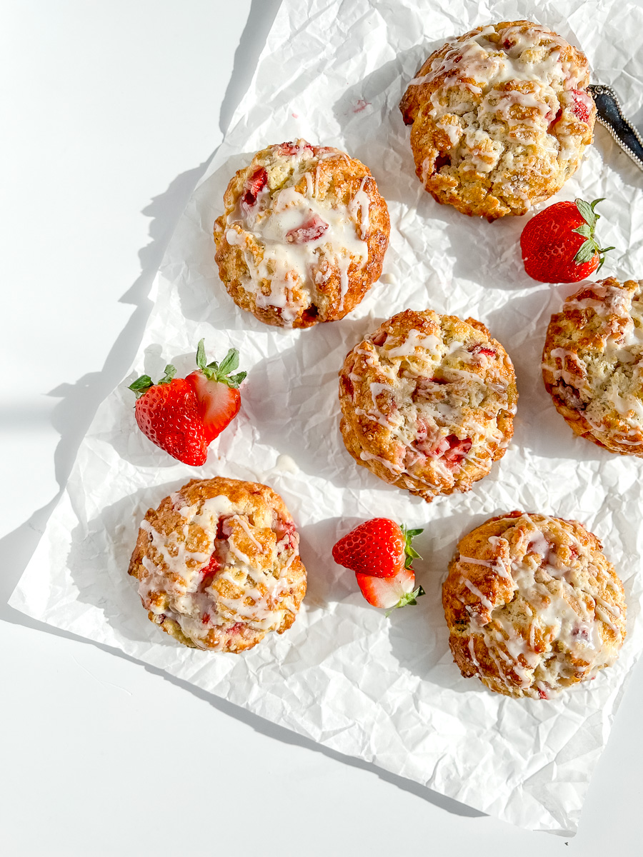 Strawberry Rosemary Scones on white parchment paper.