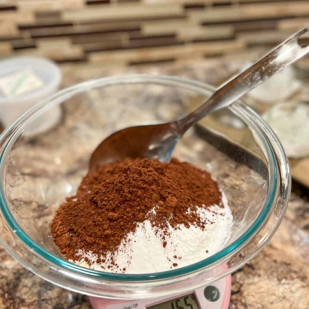 Mixing dry ingredients for chocolate muffins.