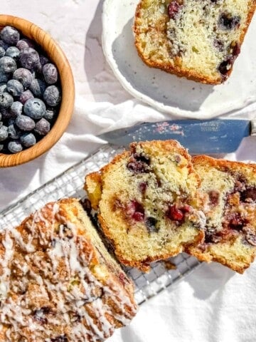 Slices of Blueberry Streusel Scone Loaf on white background.