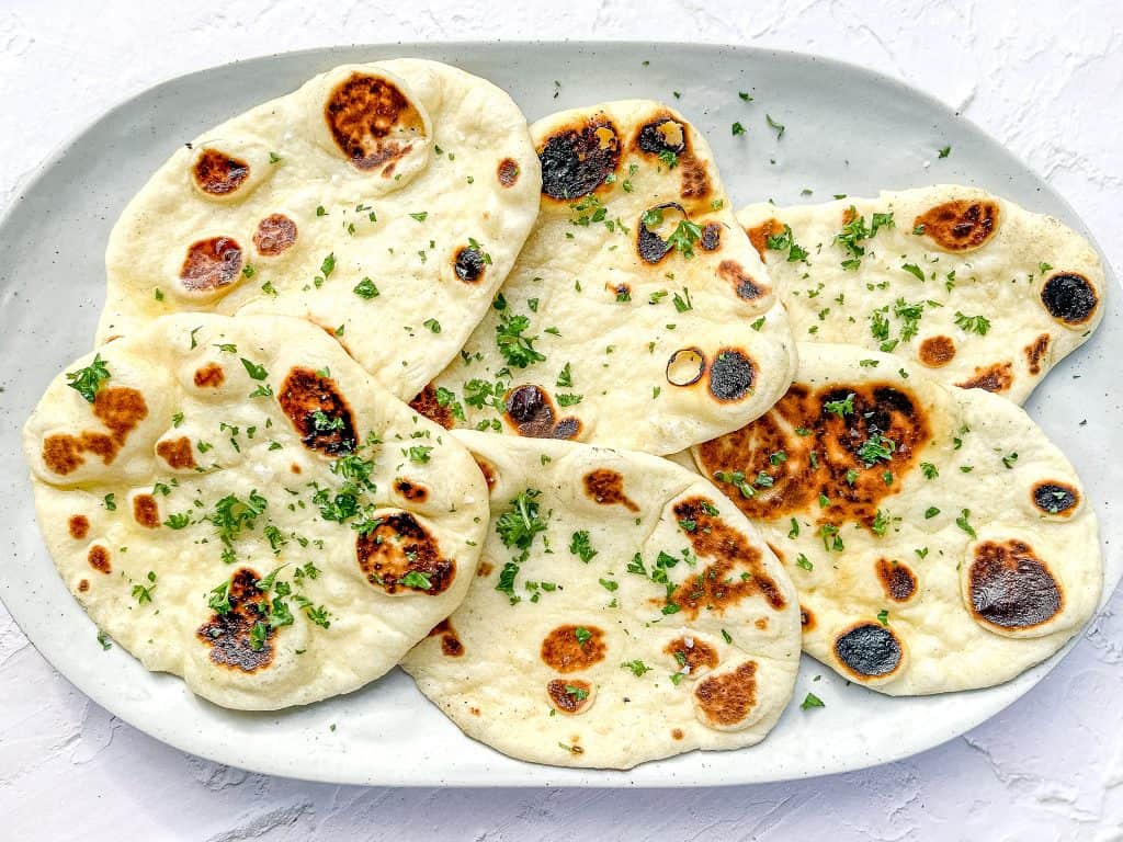 Garlic Butter Naan on a platter.