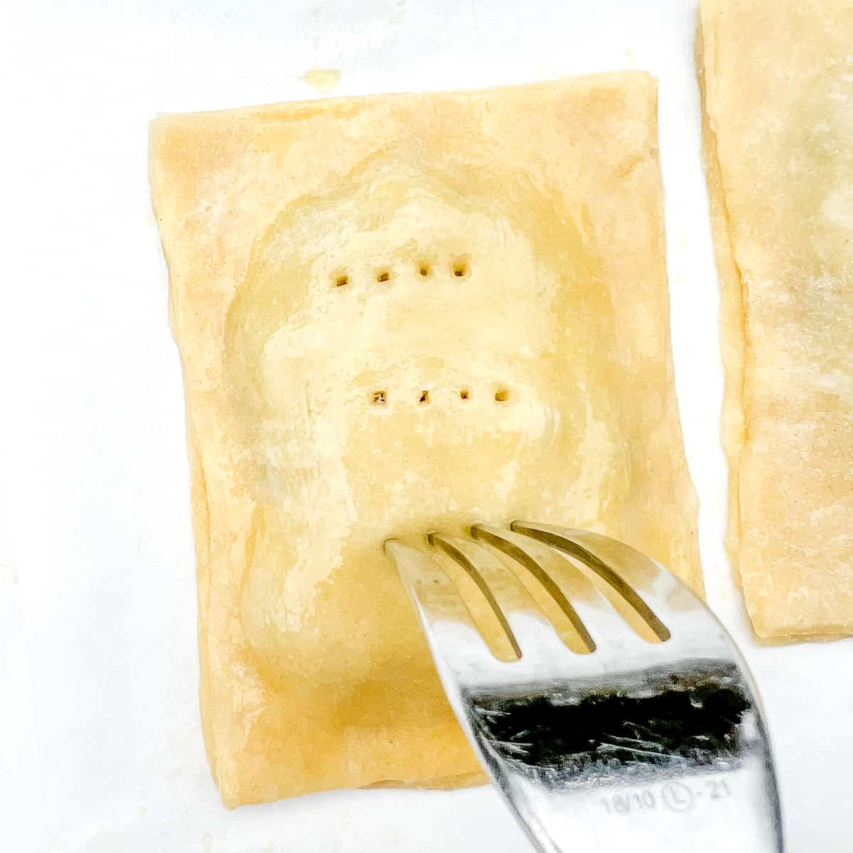 docking the top crust of pop tart with a fork.