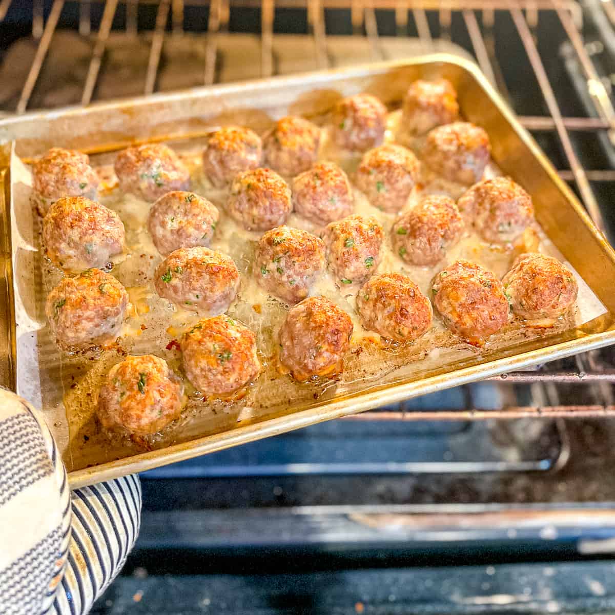 roasted italian meatballs on a sheetpan.