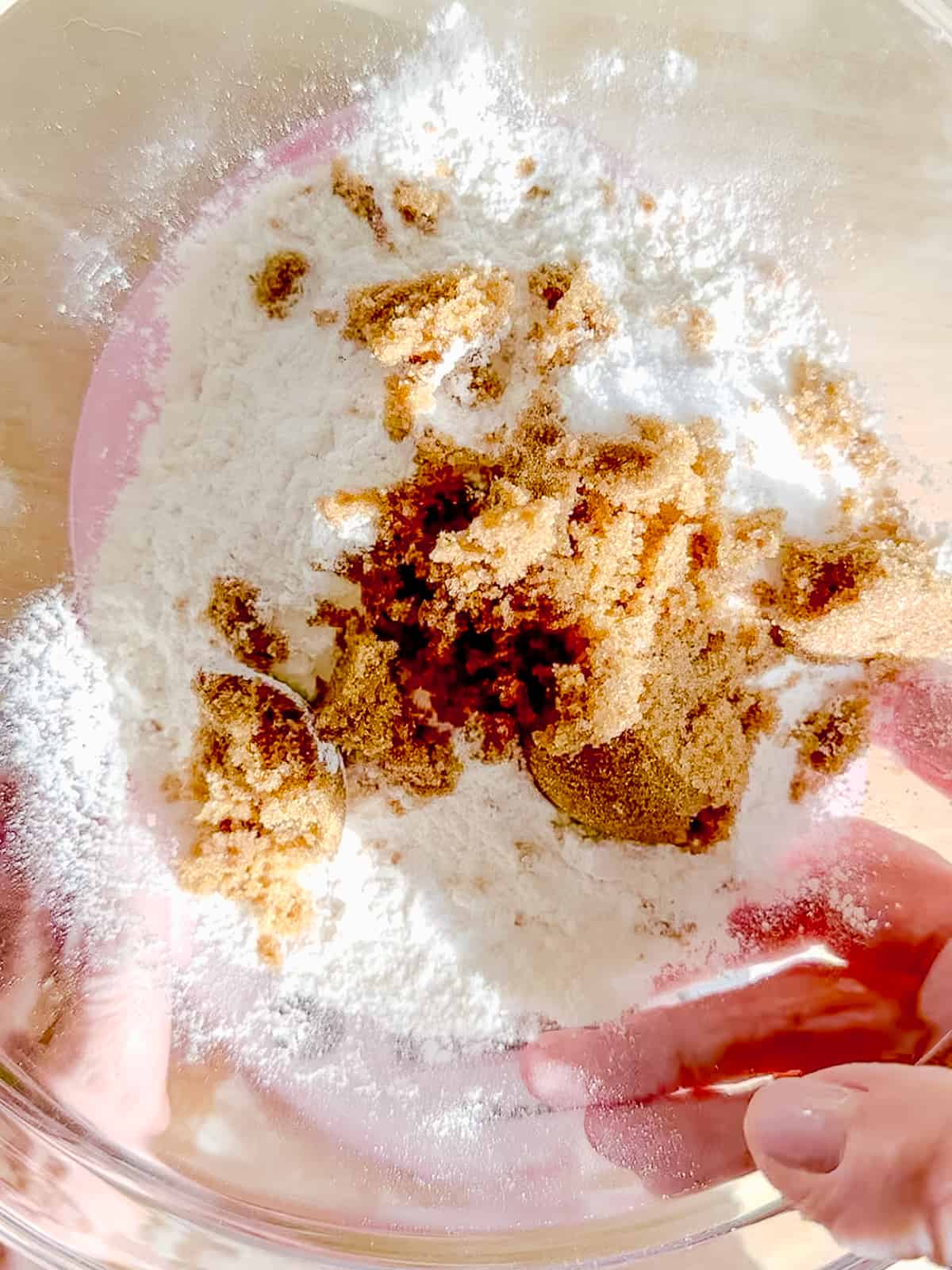 Mixing biscuit dry ingredients in a bowl.