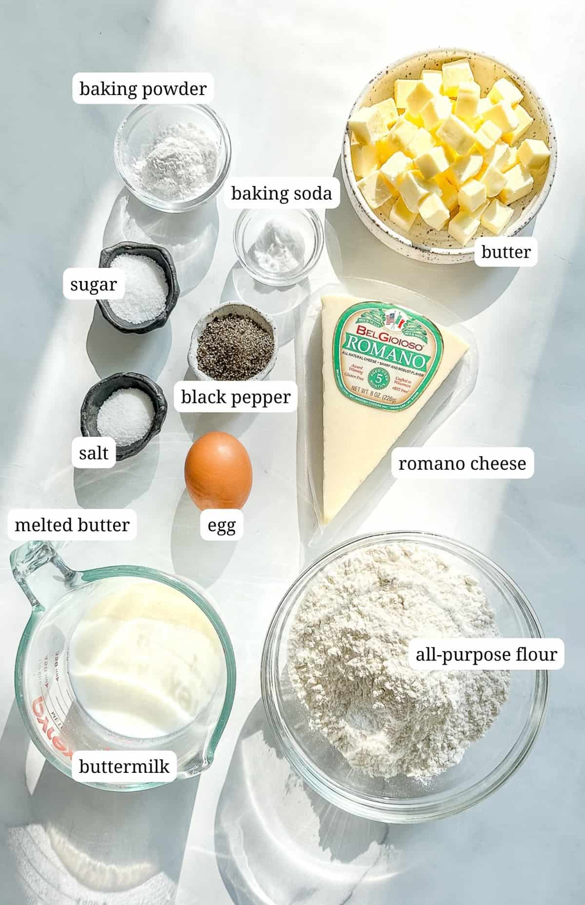 labeled ingredient image for making cacio e pepe biscuits.