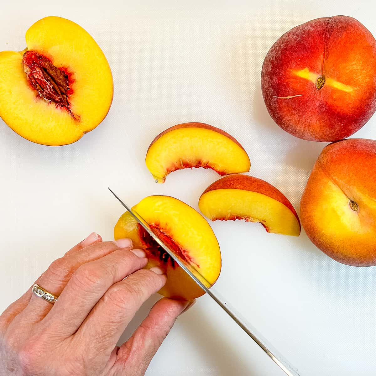 slicing a peach into eighths.