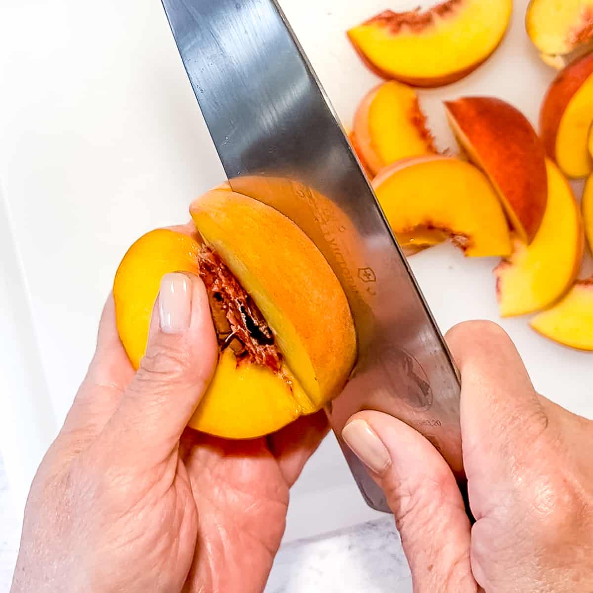 slicing a peach.