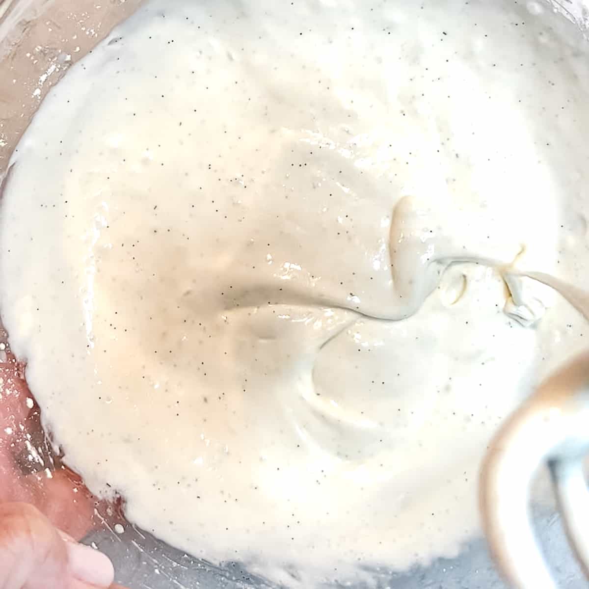 smooth cream cheese glaze in a bowl.