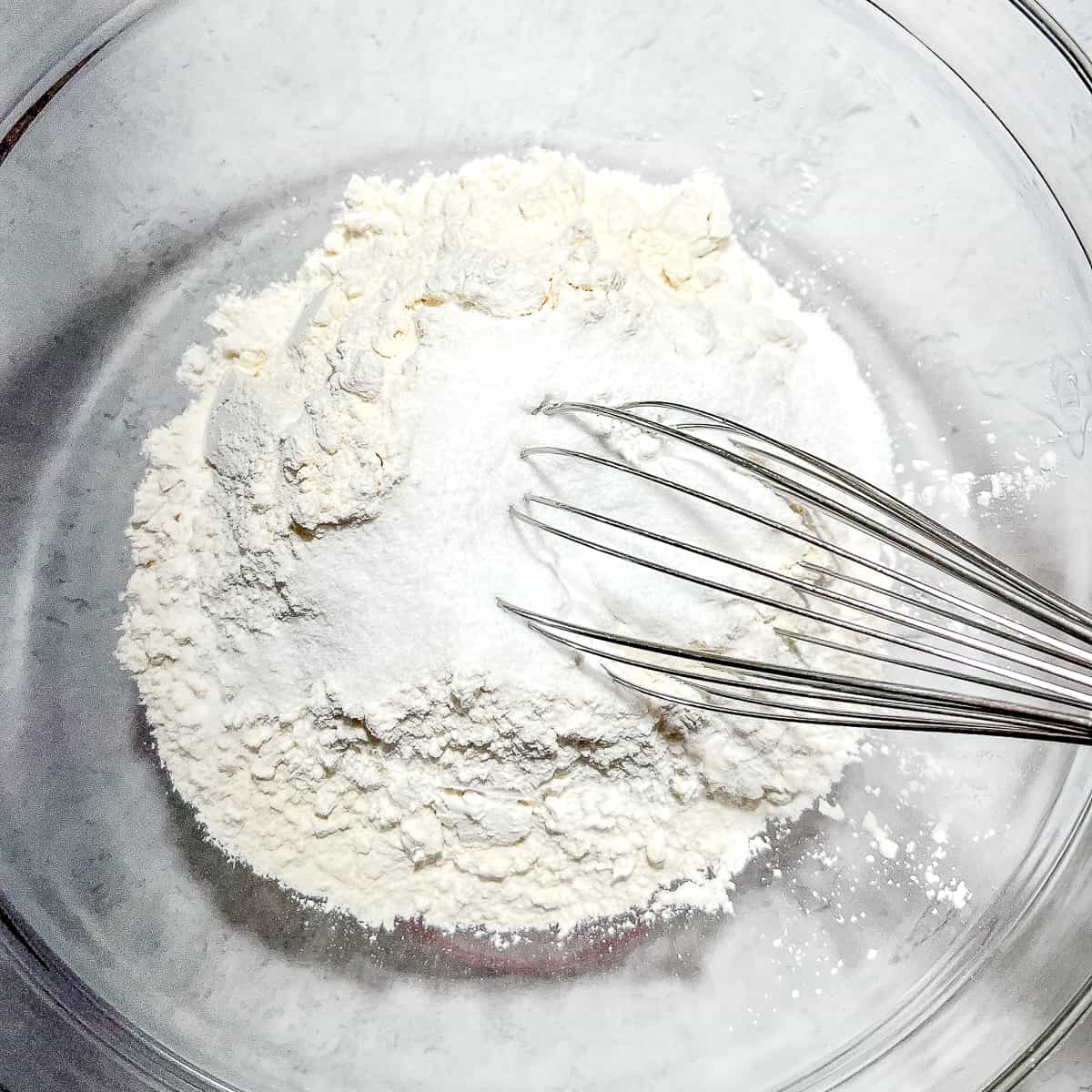 whisking together dry ingredients.