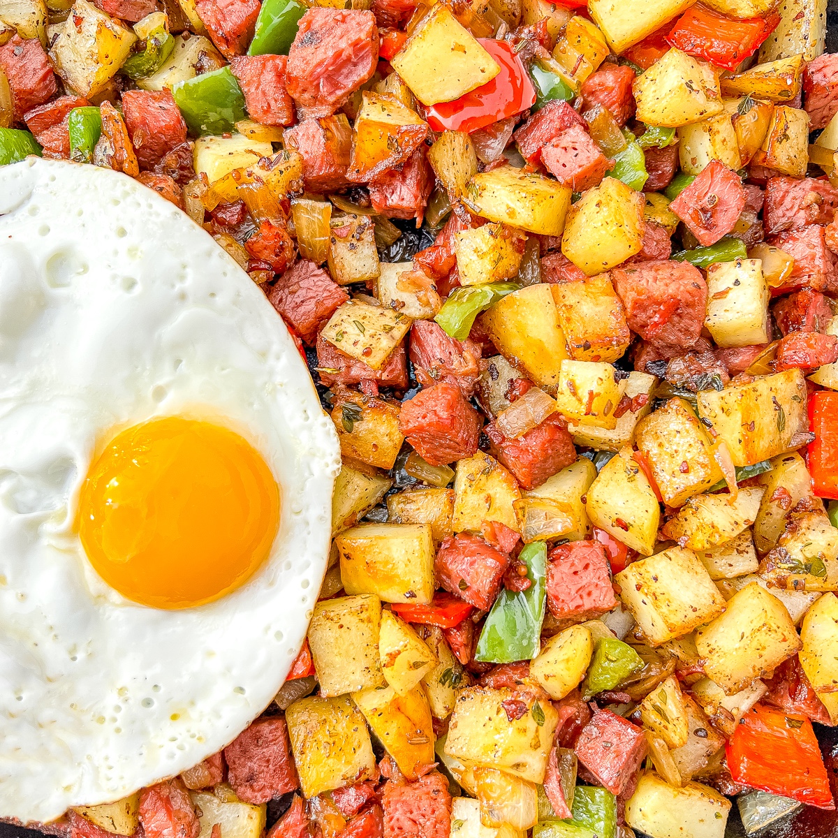 corned beef hash with a sunny side up egg.