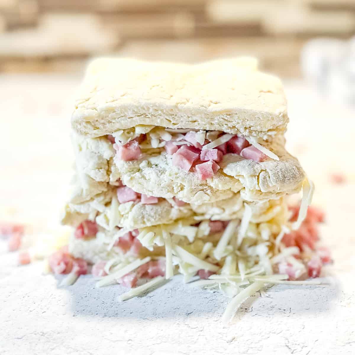 bits of ham and swiss cheese sandwiched between layers of biscuit dough.