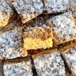 Slices of crumb cake on parchment paper.