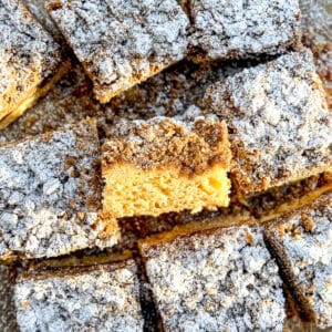 Slices of crumb cake on parchment paper.