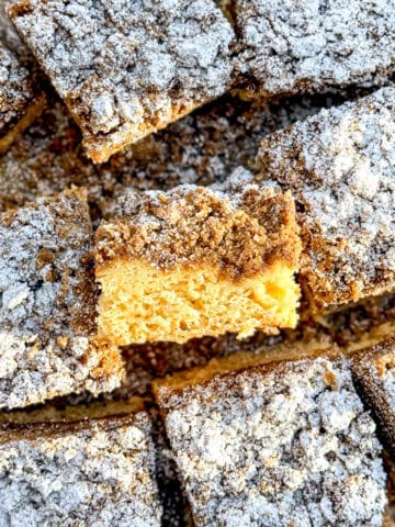 Slices of crumb cake on parchment paper.