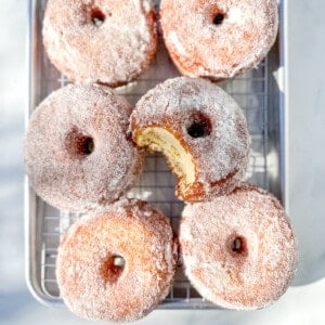 yeast donuts on a sheet tray.