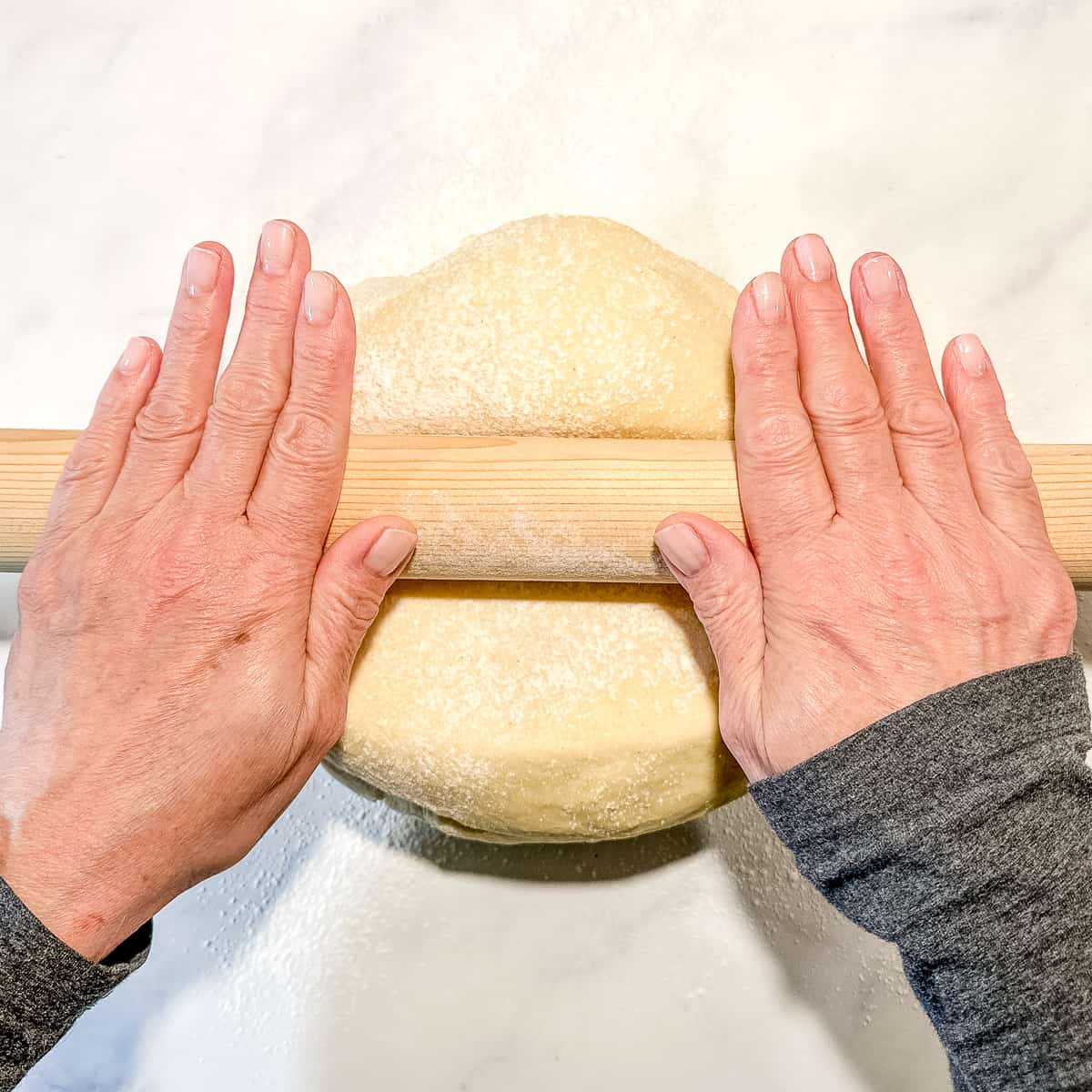 rolling out brioche dough.