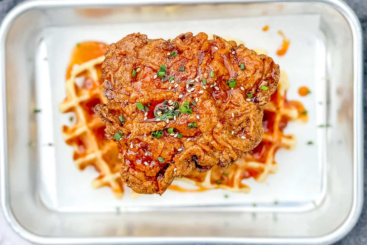 korean fried chicken on a waffle in a sheet tray.
