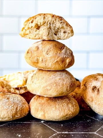A stack of crusty bread rolls.