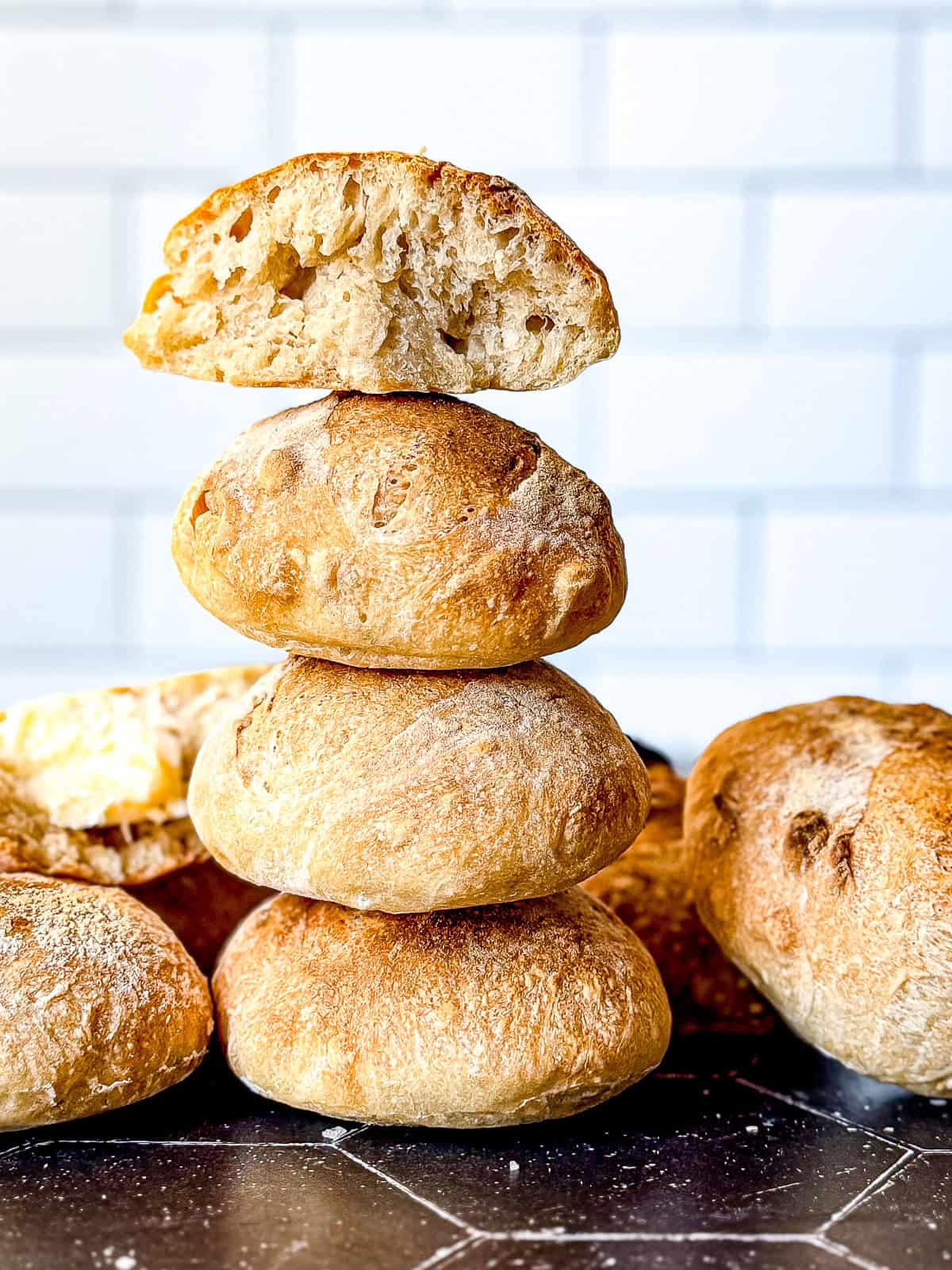 A stack of crusty bread rolls.