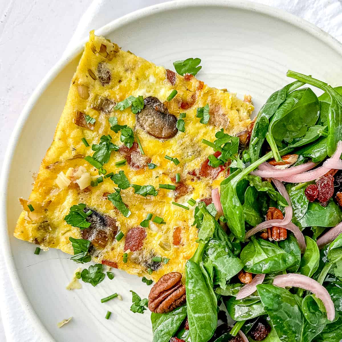 serving sheet pan frittata with a side salad for dinner.