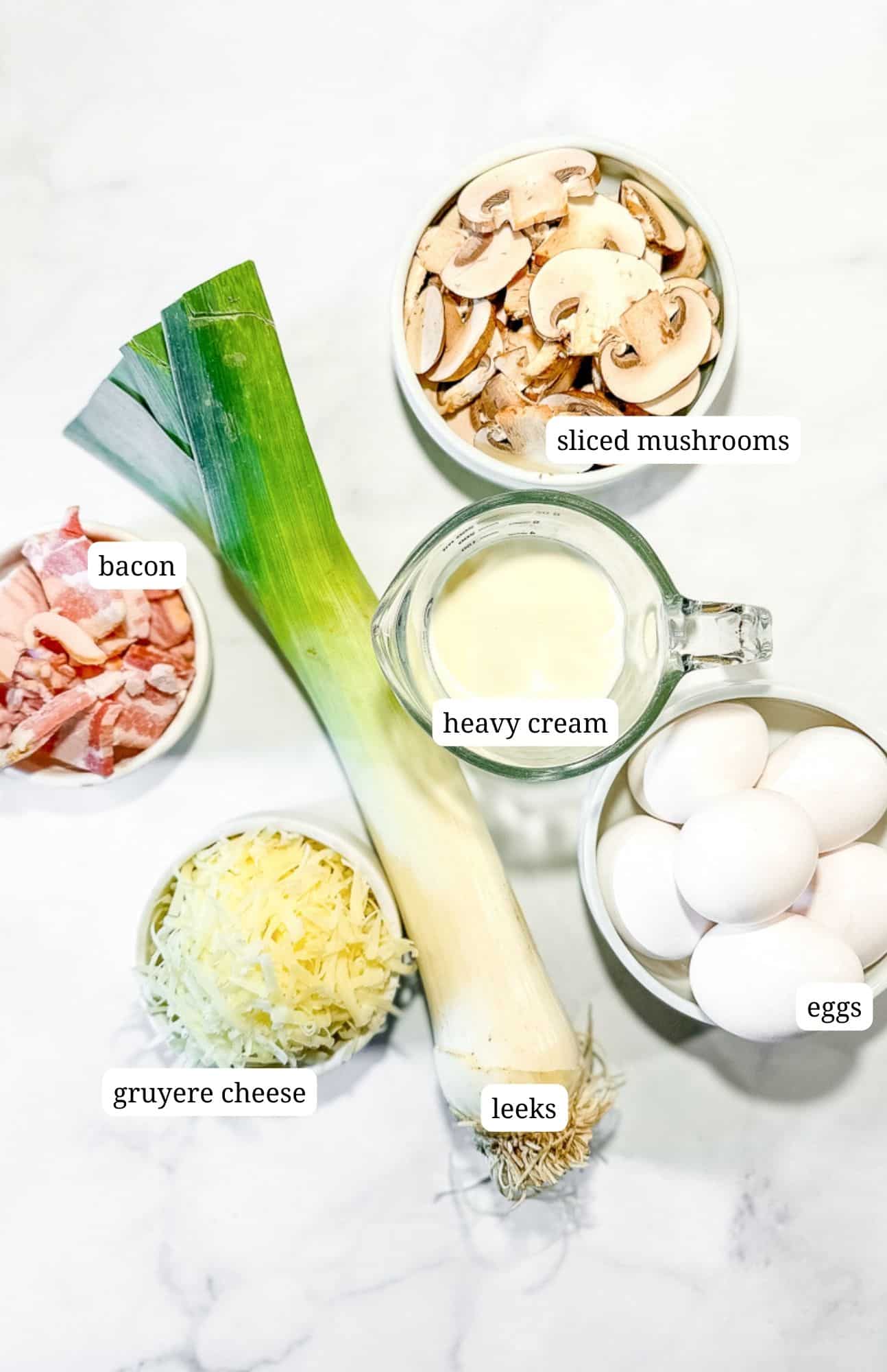 Ingredients for sheet pan frittata with mushrooms, bacon, and leeks.