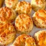 sheet tray full of ham and swiss biscuits.