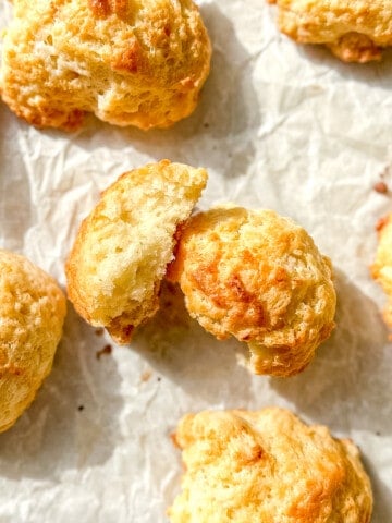 fluffy drop biscuits on parchment paper.