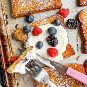 french toast on a sheet pan with yogurt and fruit.