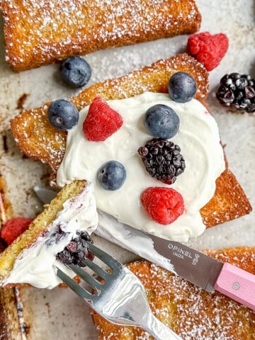 french toast on a sheet pan with yogurt and fruit.