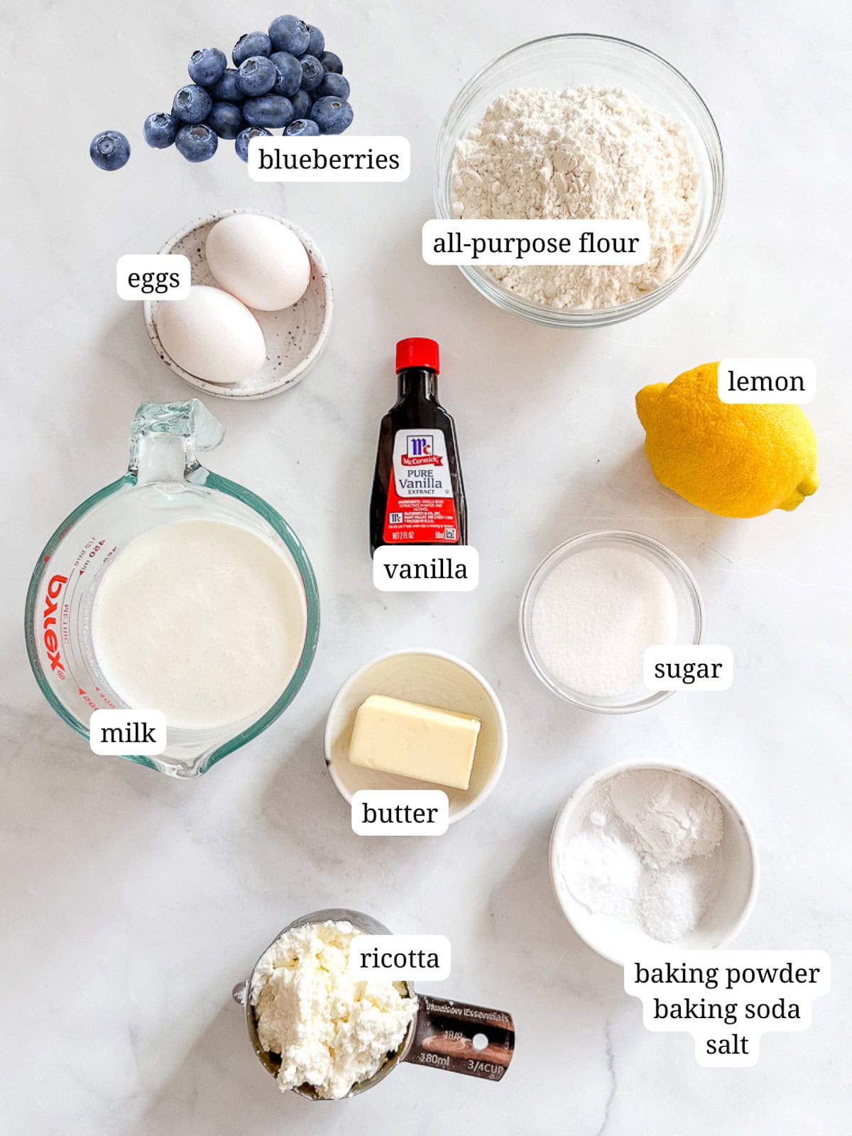 Ingredients to make lemon ricotta pancakes with blueberries.