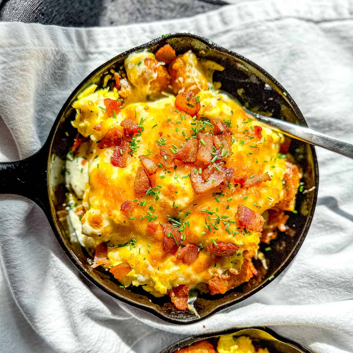tater tot breakfast poutine in a small skillet.