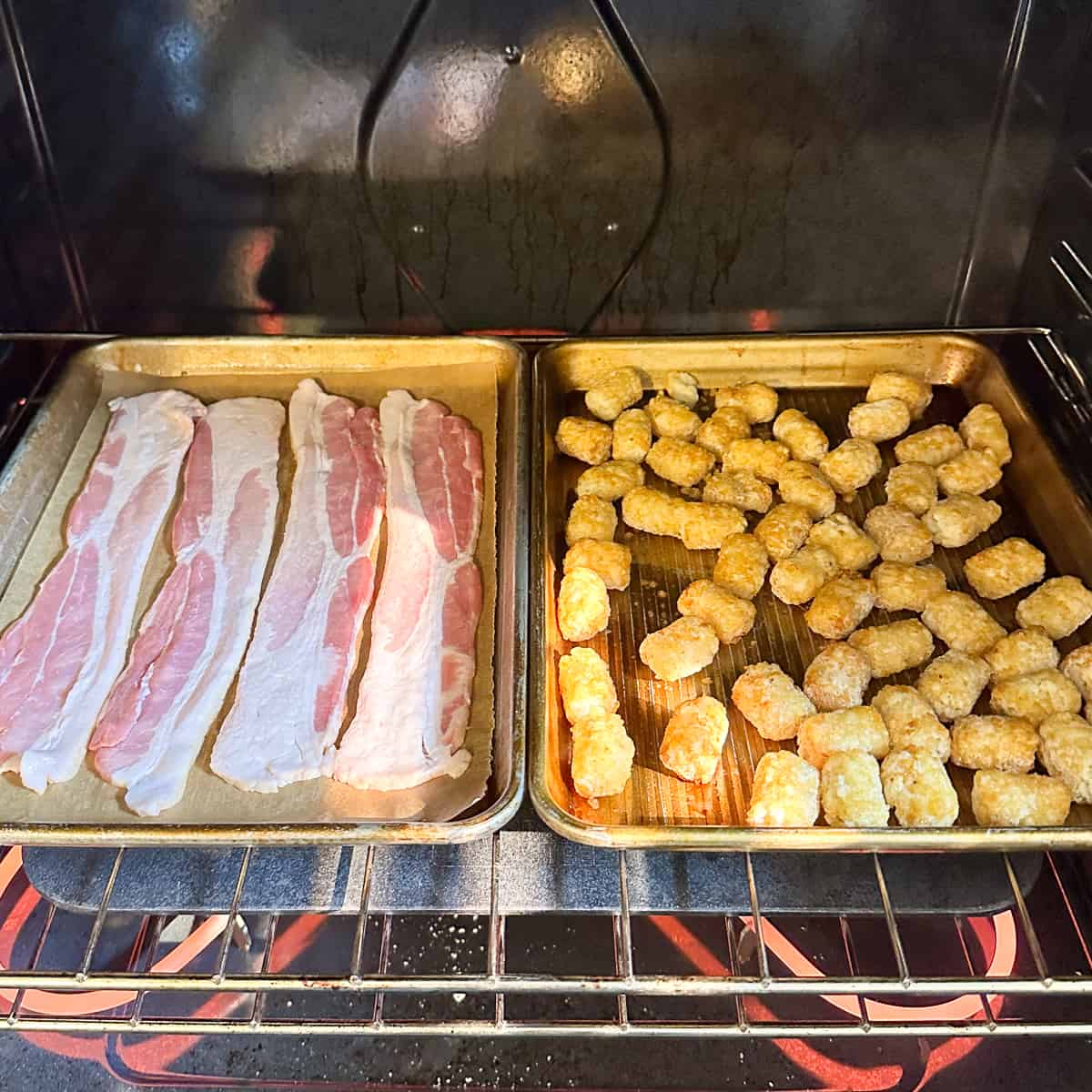 placing bacon and tater tots in the oven to bake.