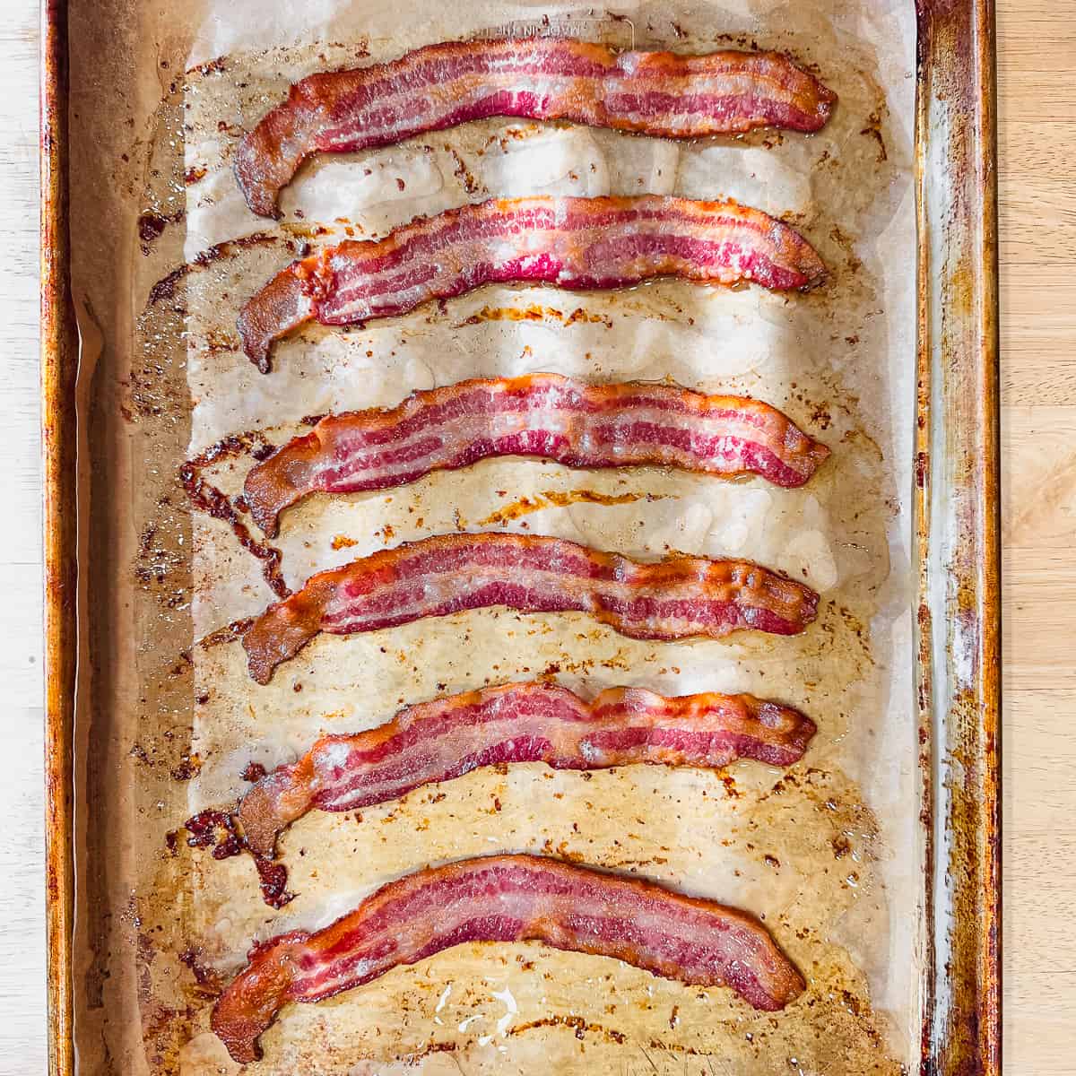 cooked bacon on a sheet pan.