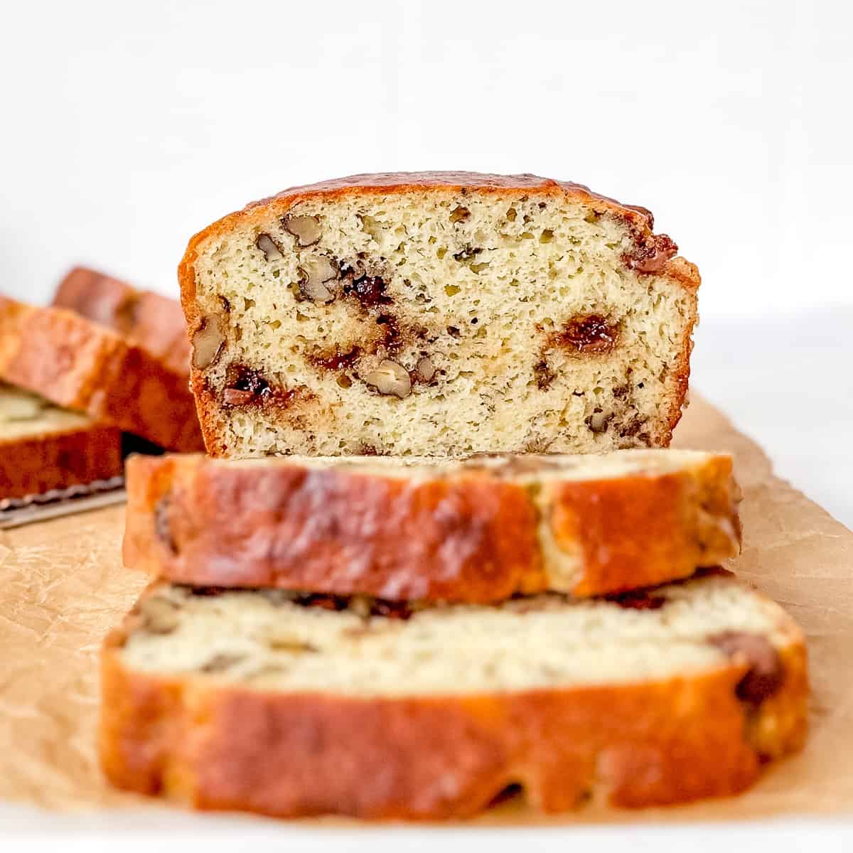 Front view of a sliced loaf of banana bread.