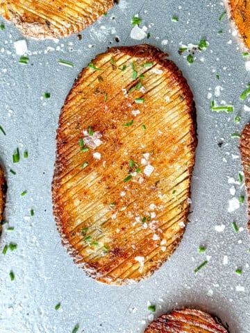 Accordion potatoes on a sheet pan.