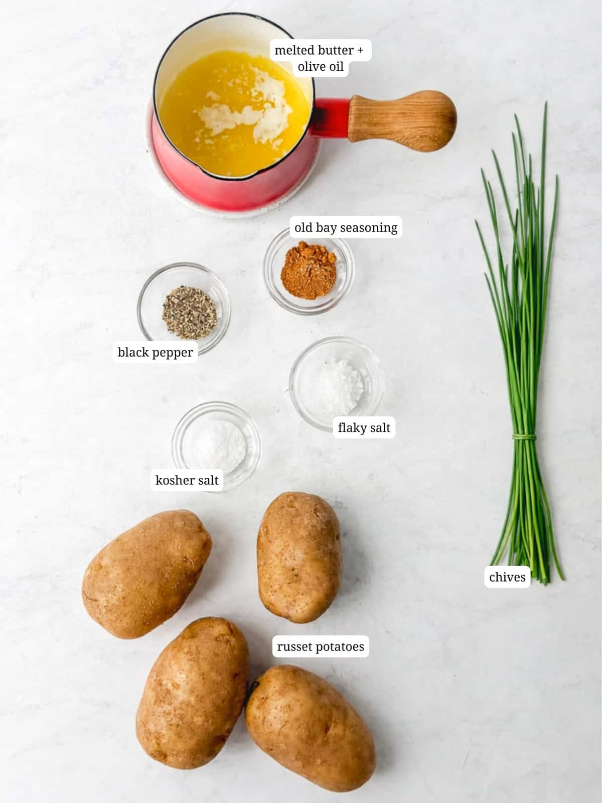 Ingredients needed to make accordion potatoes.