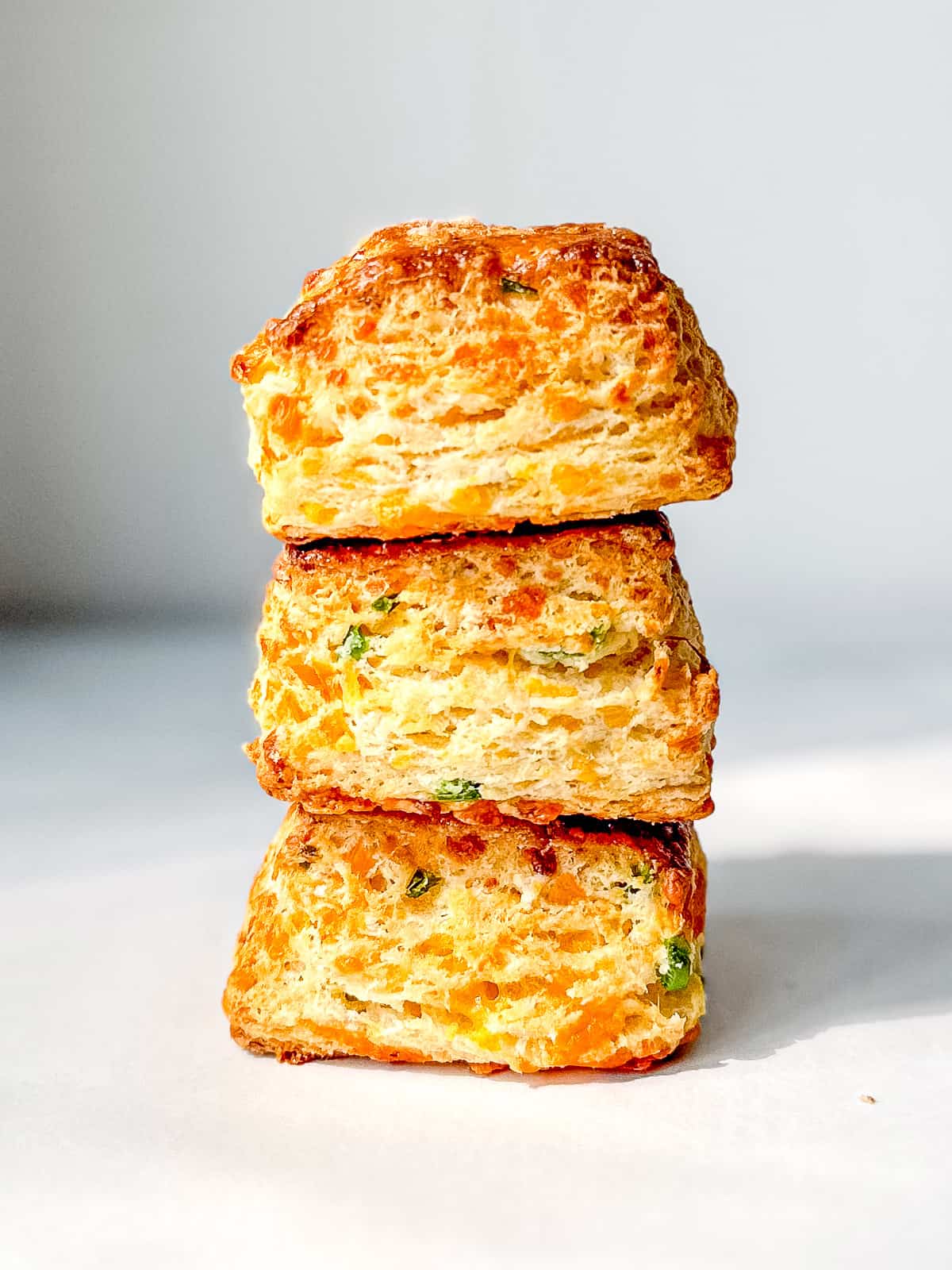 A side view of a stack of jalapeno cheddar biscuits.
