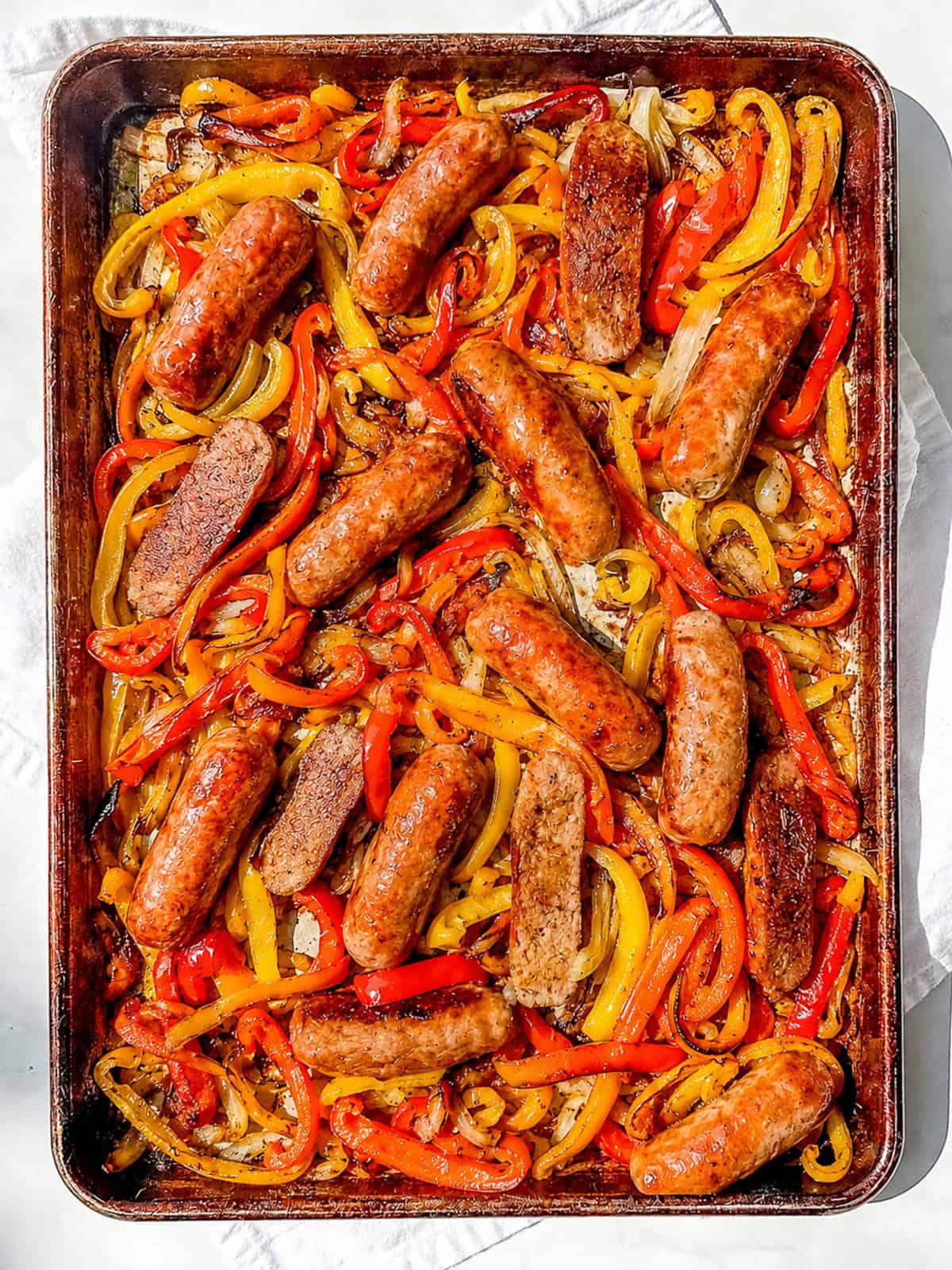Sausage and peppers on a sheet pan.