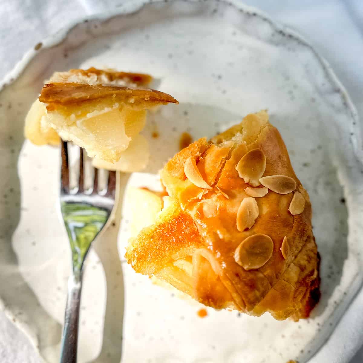 A slice of pear frangipane galette.
