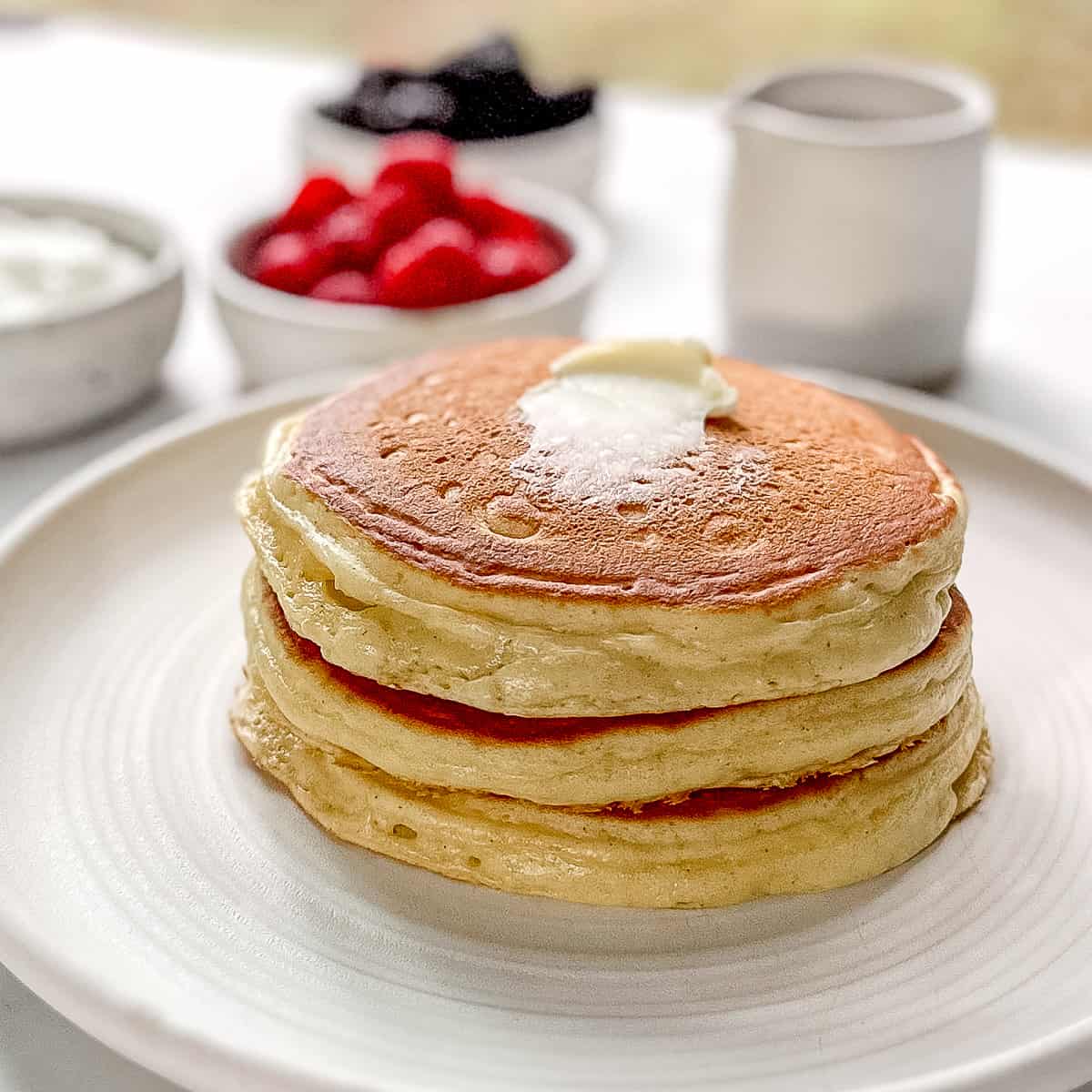 Side view of a stack of yogurt pancakes.